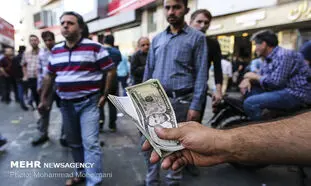 احتمال سقوط دلار به زیر 20 هزار تومان و صف کشی دلالان در میدان فردوسی!